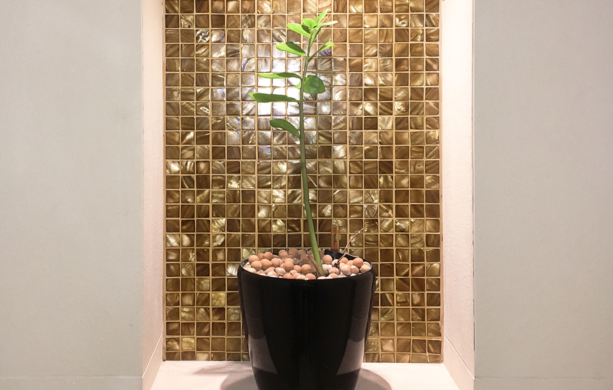 Bronze mosaic tiles in hotel bathroom